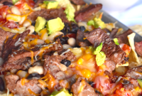 Steak Nachos Loaded with Melted Cheese, Jalapeños & Pico
