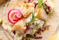 Crispy Cod Tacos with Zesty Slaw and Lime Crema