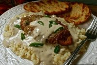 Spoon-Tender Pork Chops and Savory Gravy over Rice