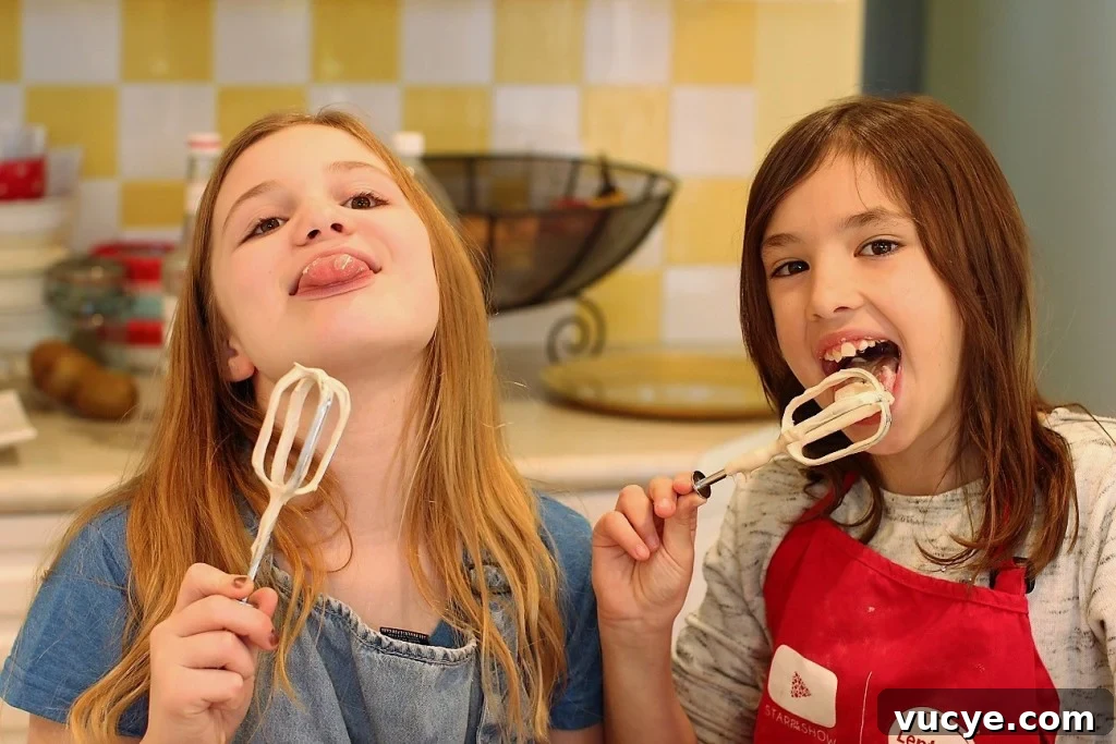 Seven-Minute Frosting Recipe Kids Can Make for Birthday Cakes 11 licking the seven minute frosting off the beaters