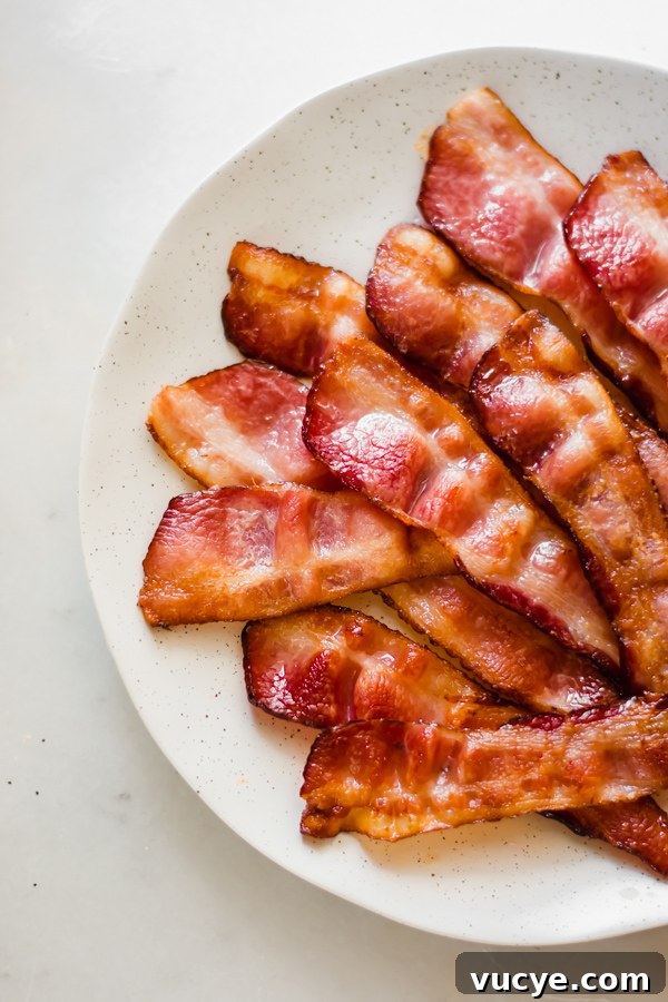 Strawberry Chicken Salad with Bacon and Poppy Seed Dressing 4 Bacon on a plate.