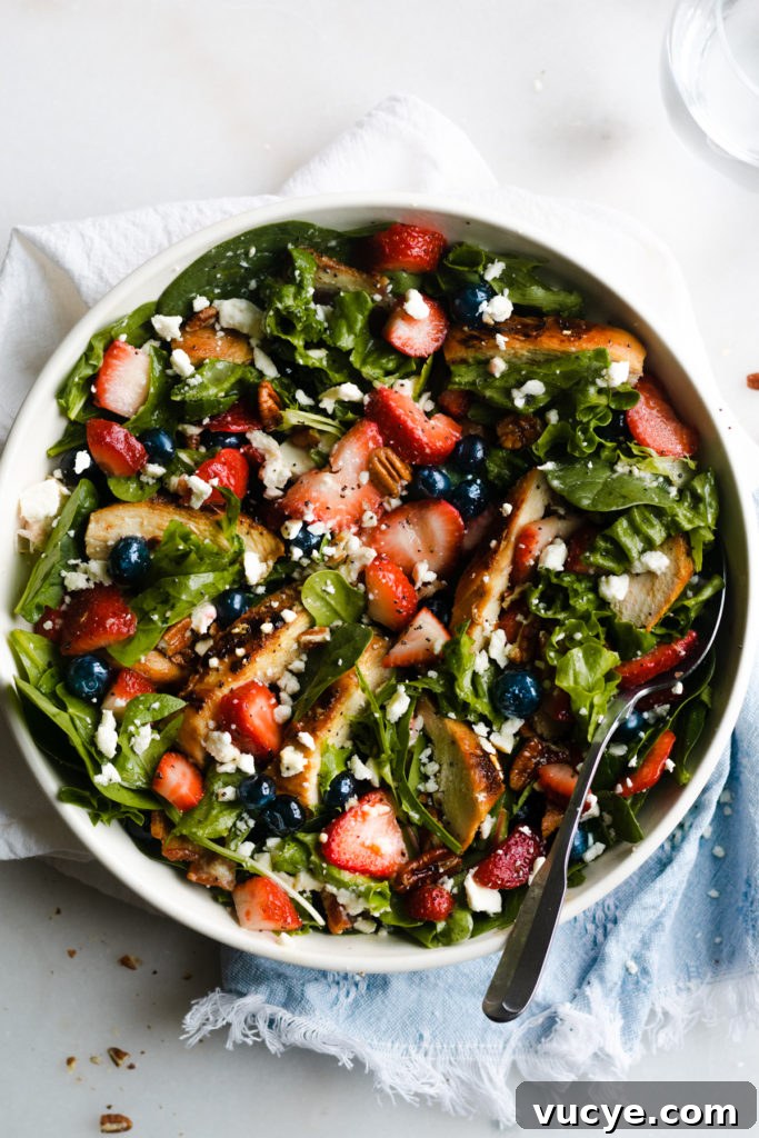 Strawberry Chicken Salad with Bacon and Poppy Seed Dressing 6 Strawberry summer salad in a bowl.
