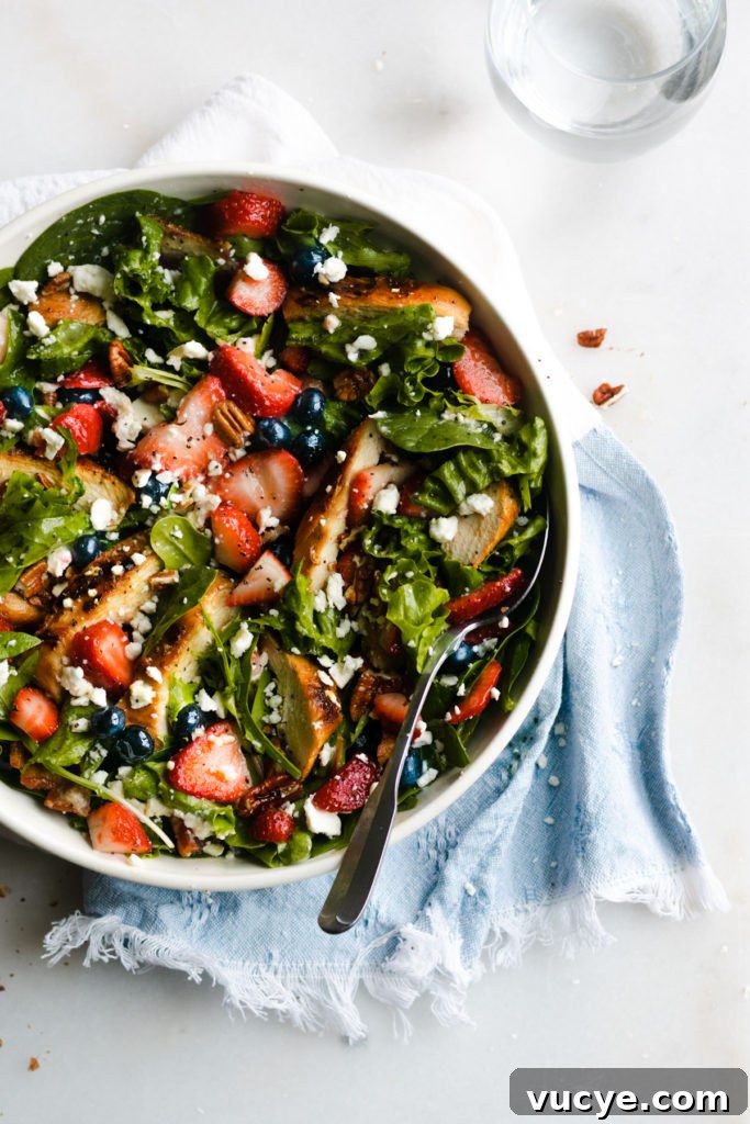 Strawberry Chicken Salad with Bacon and Poppy Seed Dressing 8 Strawberry summer salad in a bowl.