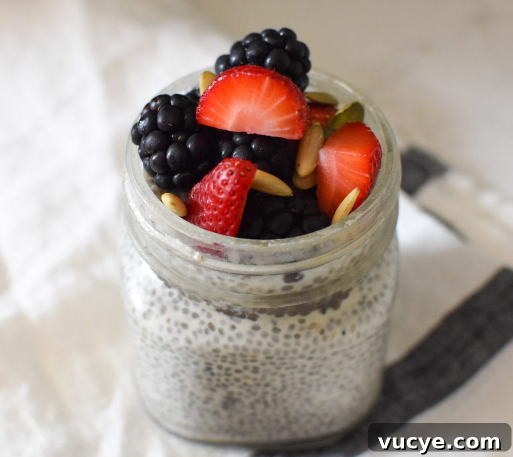 Creamy Vanilla Chia Pudding Recipe for Breakfast or Dessert 2 Chia seed pudding topped with berries and pumpkin seeds