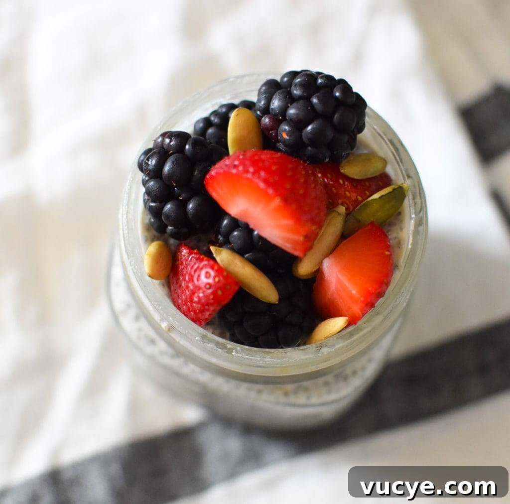 Creamy Vanilla Chia Pudding Recipe for Breakfast or Dessert 3 An overhead shot of chia pudding with blackberries and strawberries on top