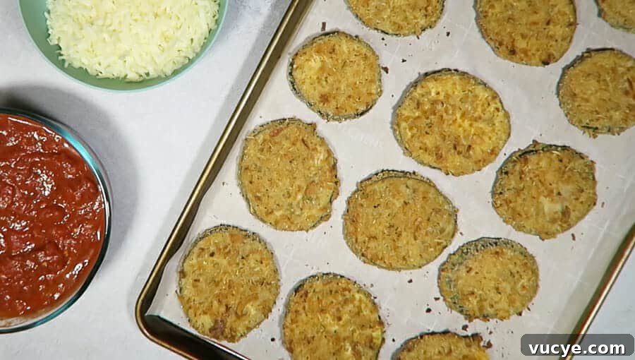 Crispy Baked Eggplant Parmesan (No-Fry, Simple Recipe) 16 overhead shot of the eggplant rounds after being baked