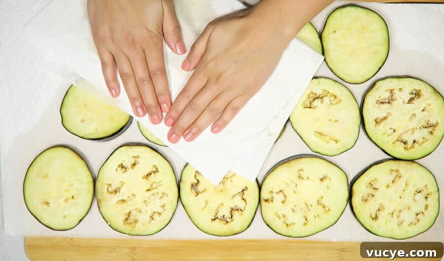 Crispy Baked Eggplant Parmesan (No-Fry, Simple Recipe) 9 drying off the eggplant rounds with paper towels for the crispy eggplant parmesan