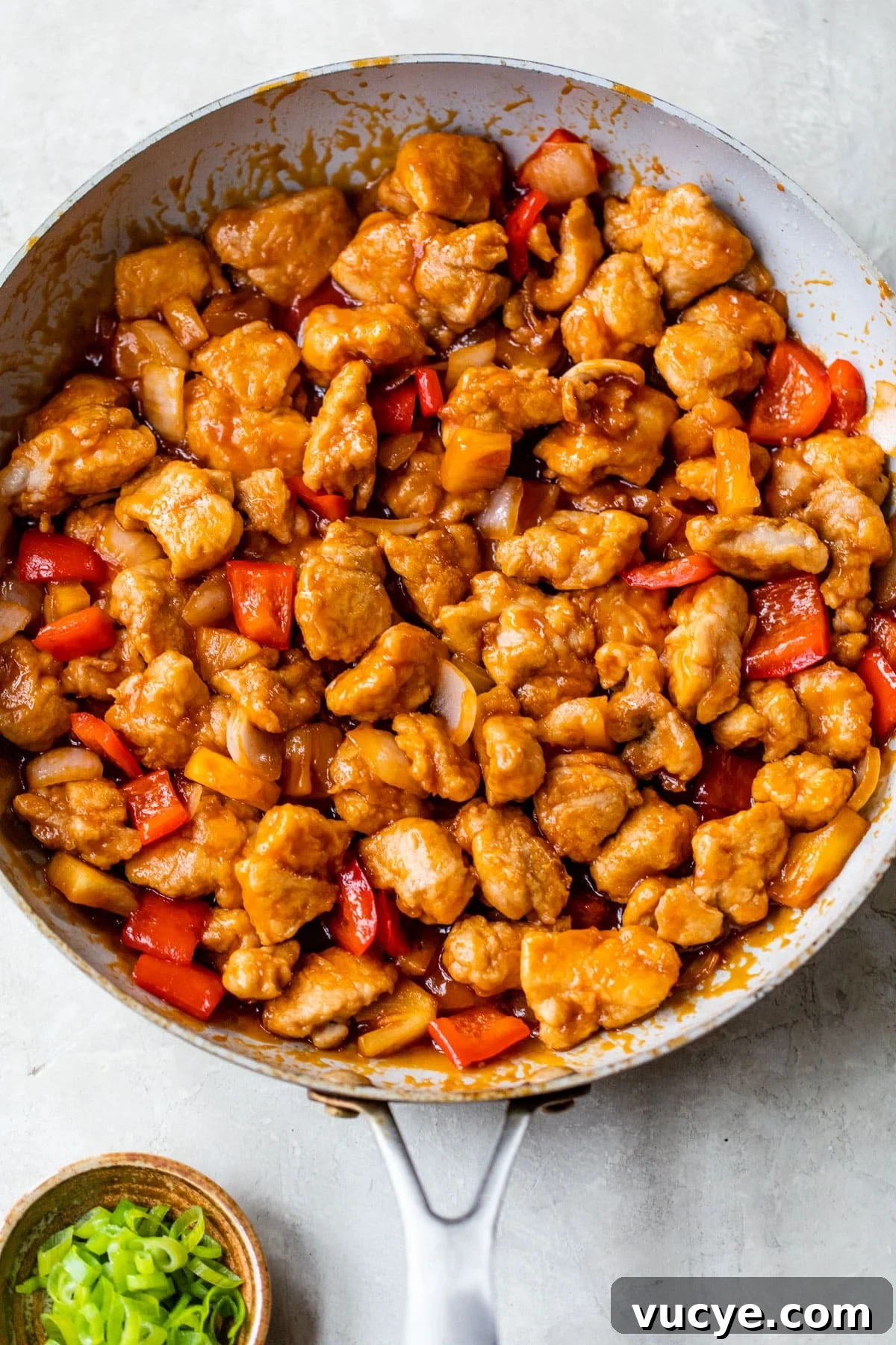 Low-Calorie Sweet and Sour Chicken Recipe for Weeknight Meals 6 skillet with sweet and sour chicken inside