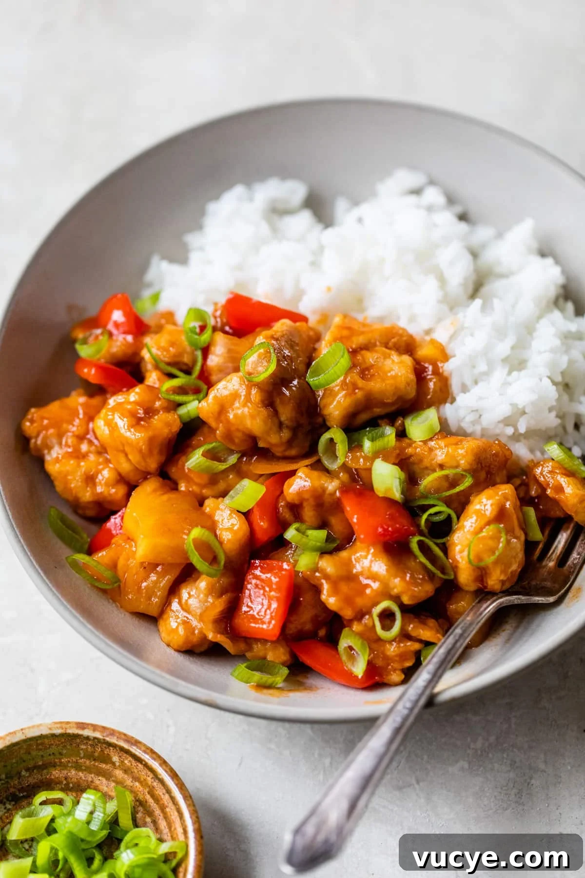Low-Calorie Sweet and Sour Chicken Recipe for Weeknight Meals 7 bowl of rice with sweet and sour chicken