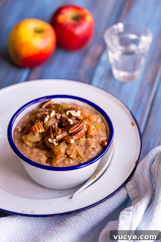 Spiced Apple & Pear Dairy-Free Porridge Recipe 2 A bowl of dairy free porridge topped with spiced apples and pears