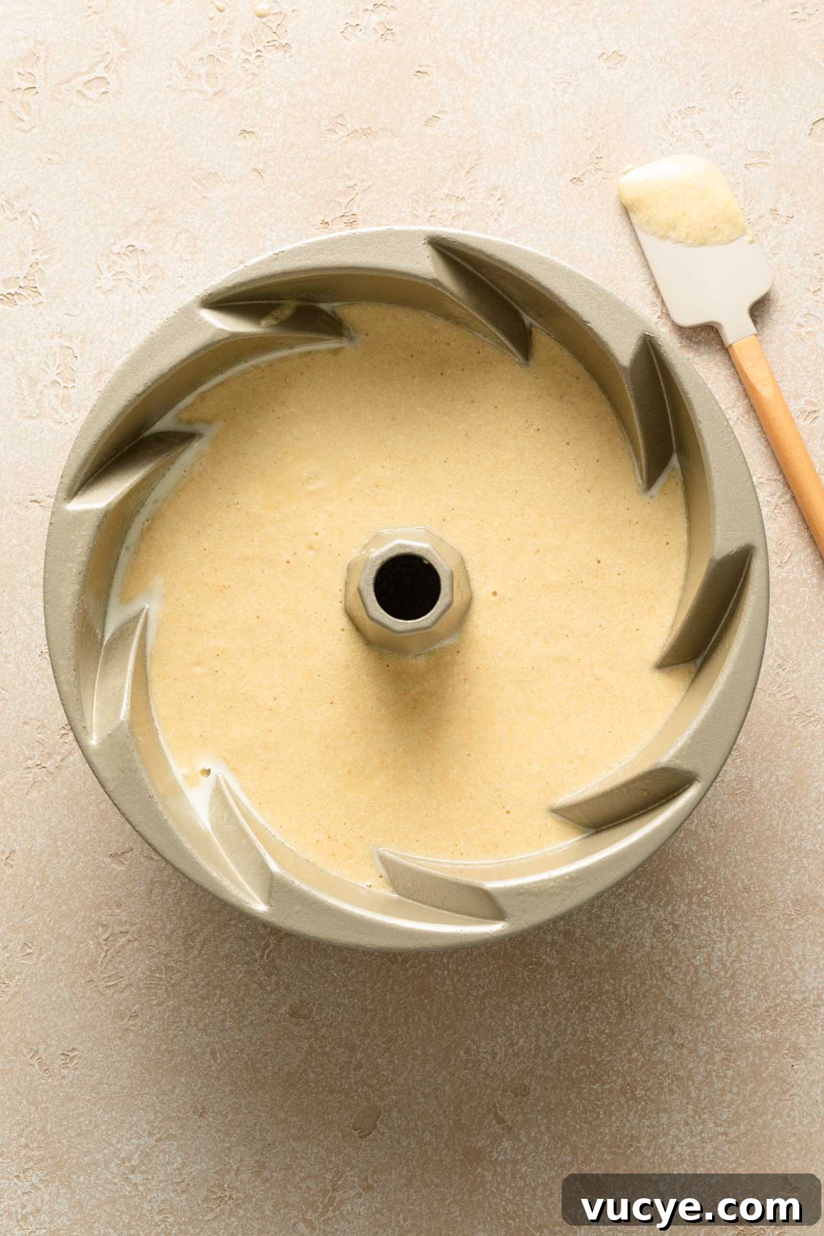 Eggnog Bundt Cake Recipe with Spiced Rum Glaze 4 Eggnog cake batter in a bundt pan.
