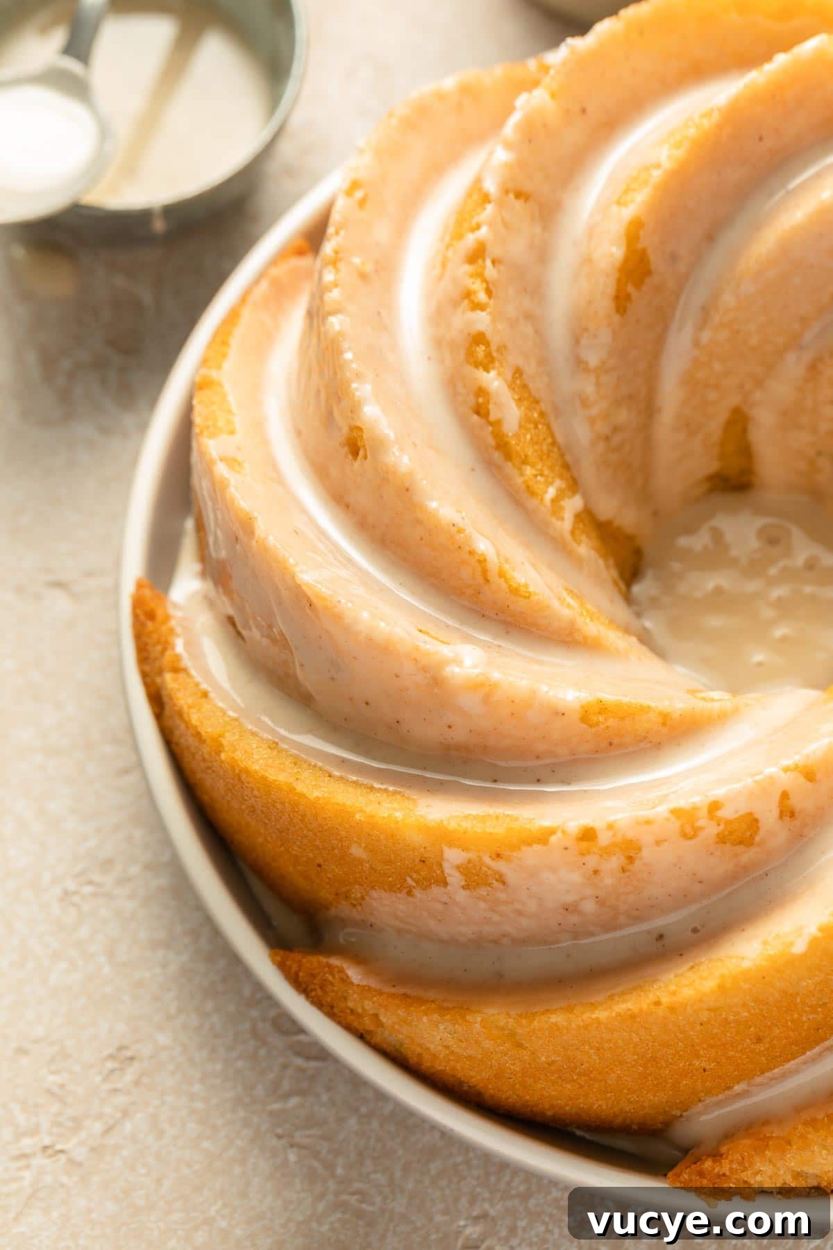 Eggnog Bundt Cake Recipe with Spiced Rum Glaze 6 Close up view of glaze on eggnog bundt cake.