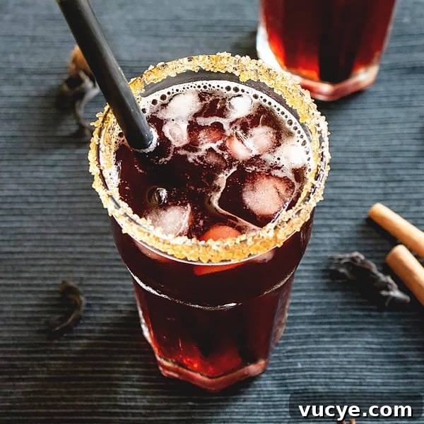 A trini sorrel cocktail drink on a dark table.