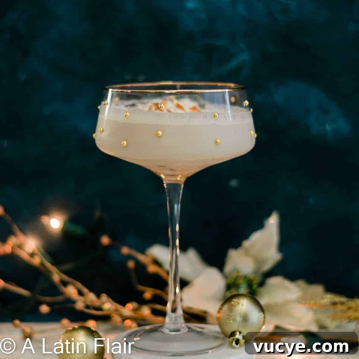 A dulce de leche rum martini on a dark blue background.