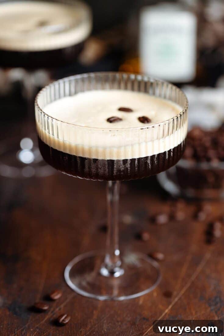 A rum espresso martini on a wooden table.