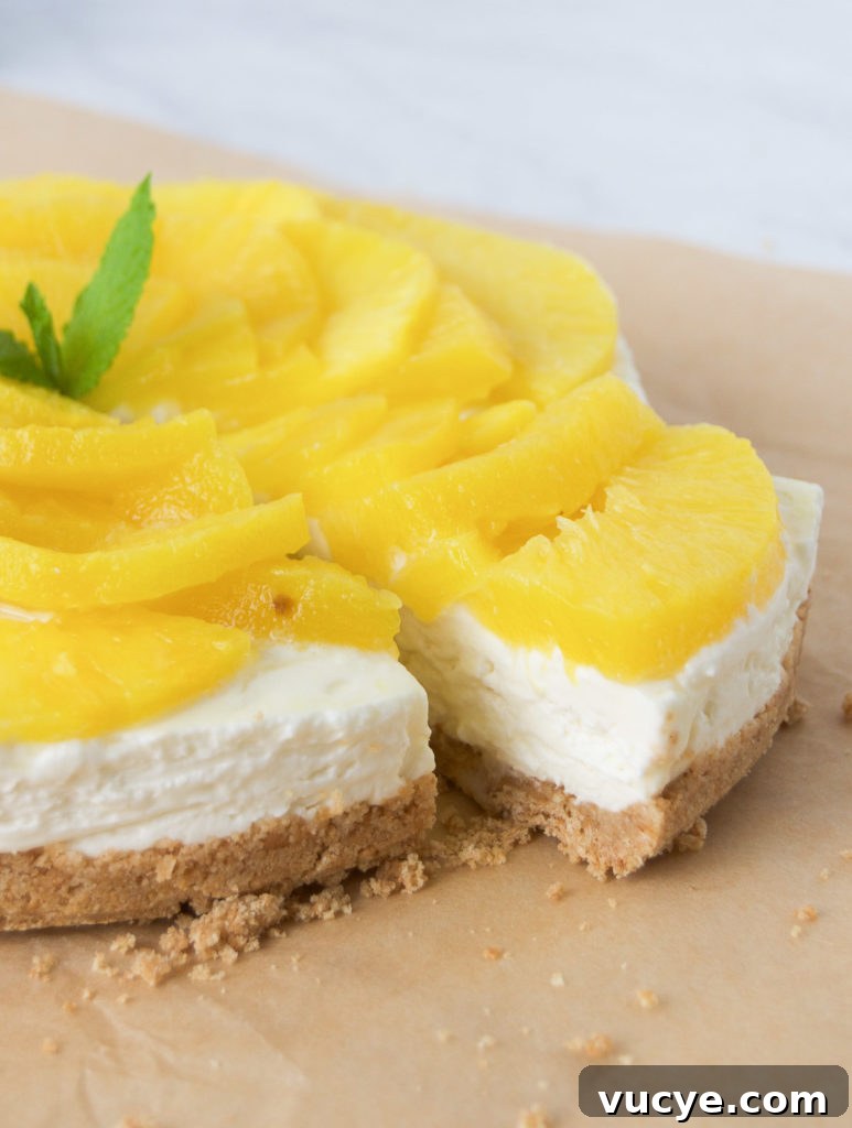 No-Bake Pineapple Cheesecake Recipe: Creamy Tropical Dessert 2 A gorgeous slice of no bake pineapple cheesecake with mint.