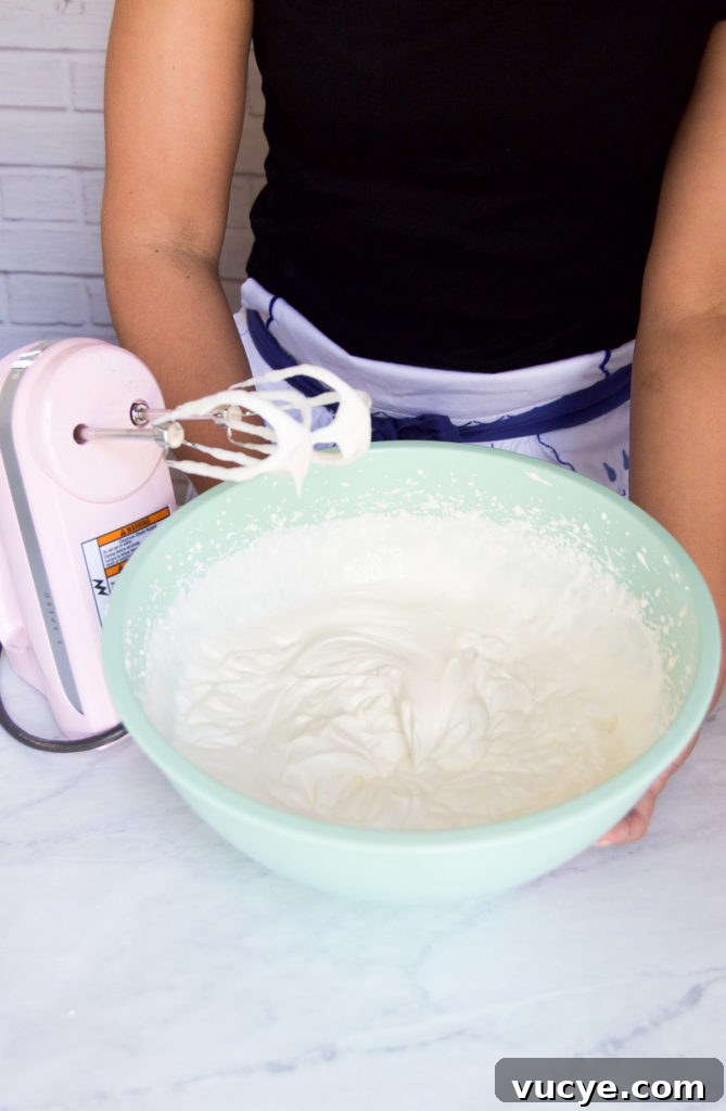 No-Bake Pineapple Cheesecake Recipe: Creamy Tropical Dessert 7 Whipped cream and cream cheese filling