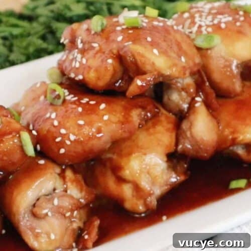 Sticky Honey Soy Chicken Drumsticks: Oven-Baked Glazed Recipe 4 Honey Soy Chicken Thighs on a white platter, baked honey soy chicken thighs.