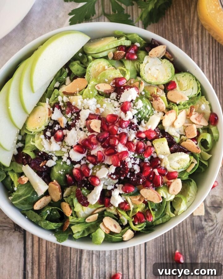 Brussels sprout salad with feta cheese, pomegranate seeds and almonds.
