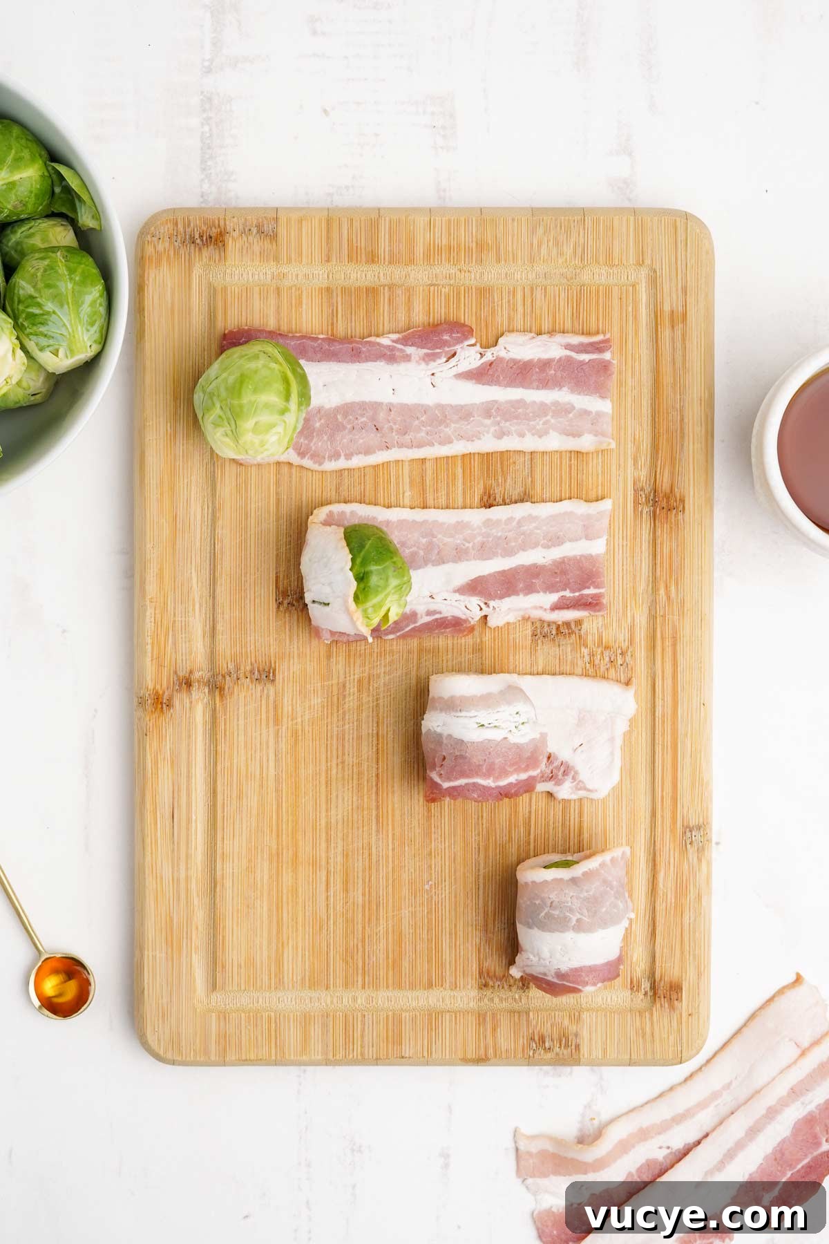Brussel sprouts added to bacon strips and shown at various intervals of wrapping.