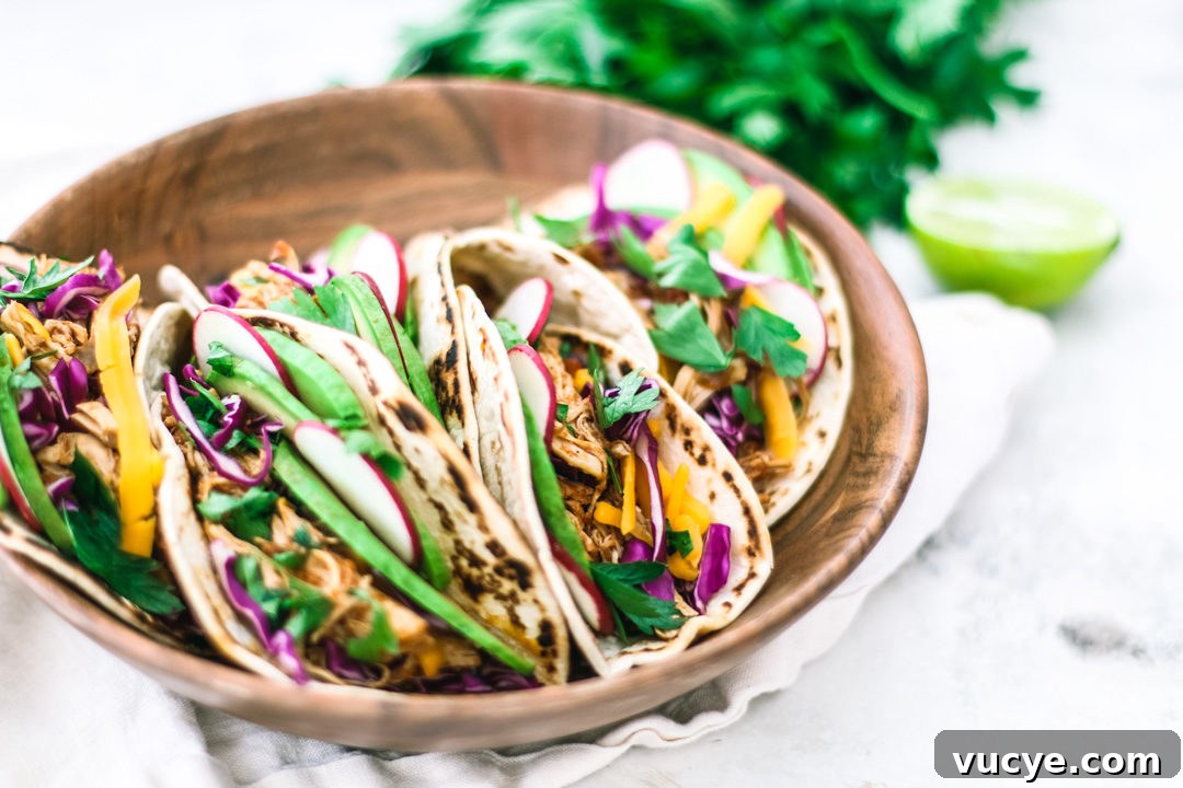 Instant Pot Chipotle Chicken Tacos | Killing Thyme Instant Pot Chipotle Chicken Tacos in a bowl