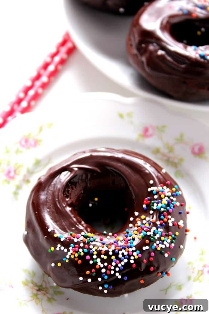 Glazed Chocolate Donuts Recipe Glazed Chocolate Donuts Recipe - baked chocolate donuts that come together in under 20 minutes, glazed with rich and silky smooth glaze.
