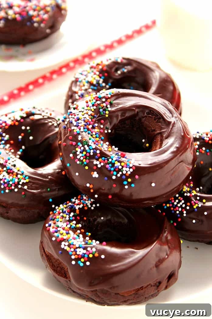 Glazed Chocolate Donuts Recipe Glazed Chocolate Donuts Recipe - baked chocolate donuts that come together in under 20 minutes, glazed with rich and silky smooth glaze.