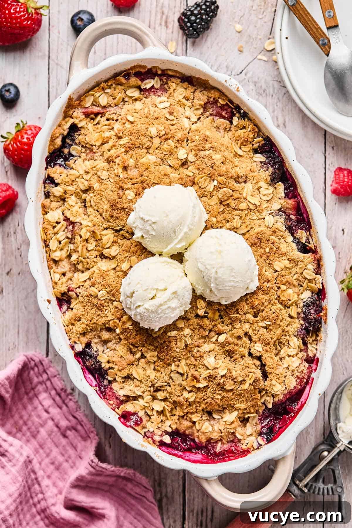 Naturally Sweetened Gluten-Free Berry Crisp Recipe 11 baked gluten free berry crisp with two scoops of vanilla ice cream on top