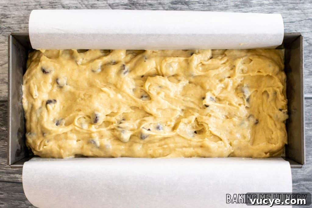 batter in loaf pan lined with parchment