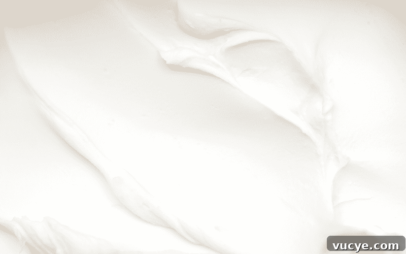 Close-up texture of creamy cream cheese.