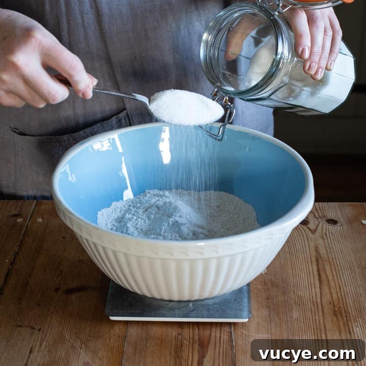 measuring sugar into bowl
