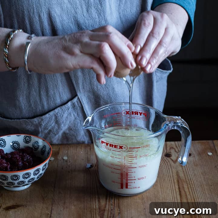 cracking egg into jug