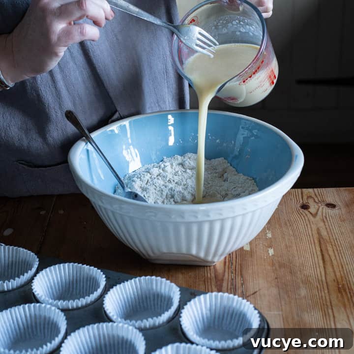 pouring wet into dry ingredients