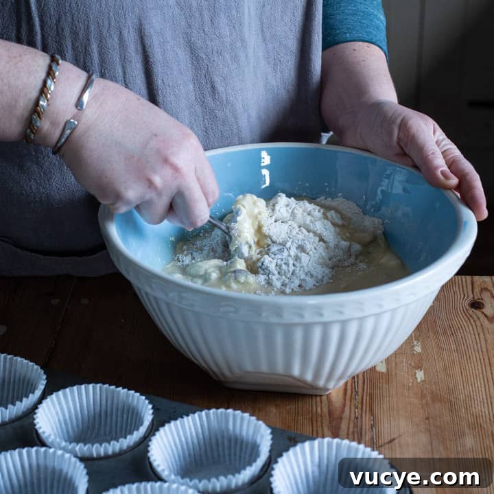mixing muffin batter in bowl