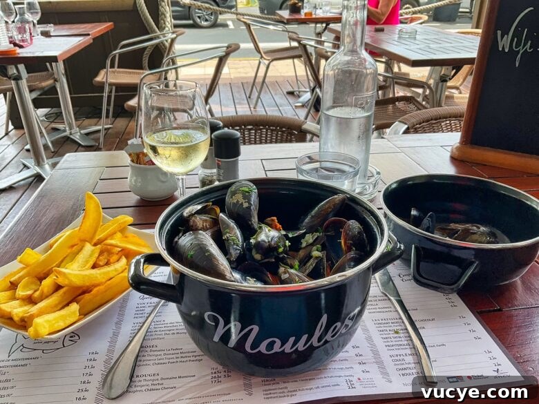 Western European Flavors: Iconic Dishes and Regional Specialties 3 A pot of moules and a plate of frites at a French restaurant