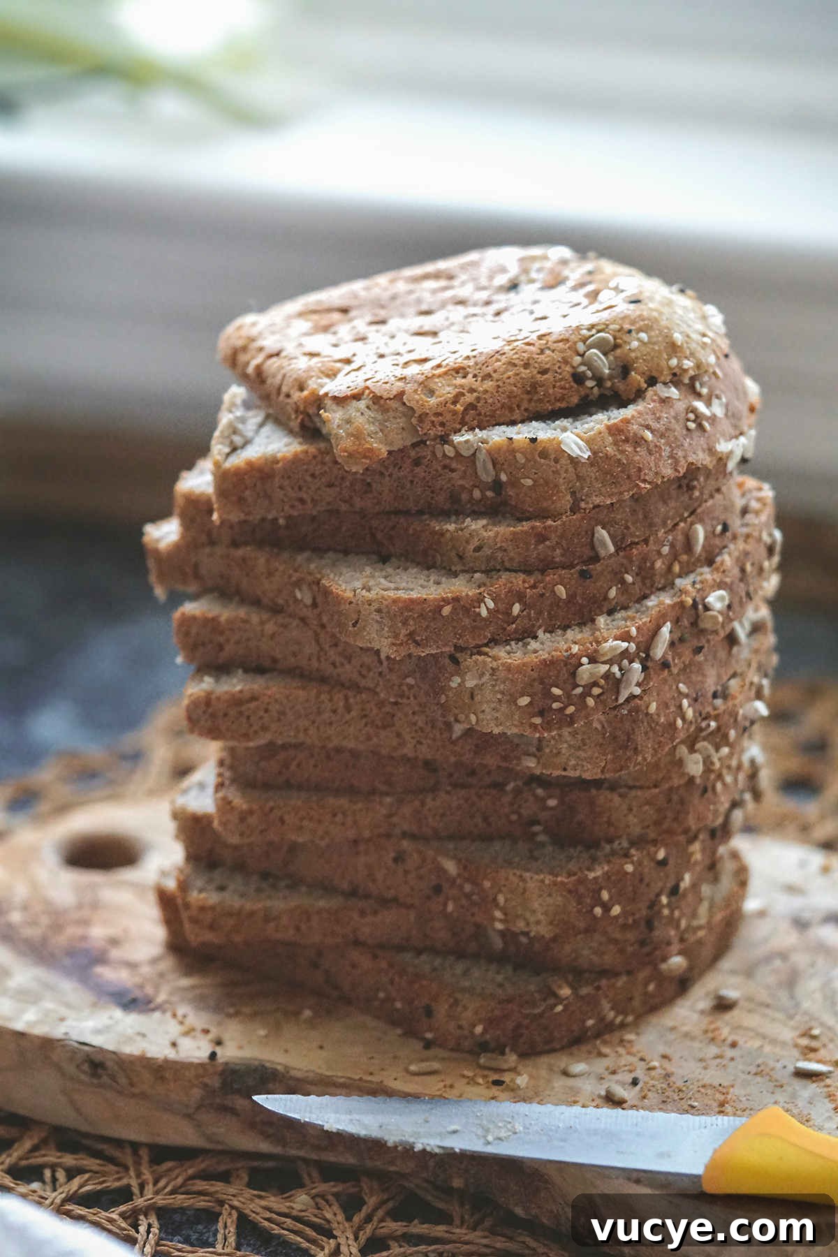 Soft Gluten-Free, Dairy-Free Buckwheat Bread Recipe 10 Sliced buckwheat flour bread, slices staked on a board.