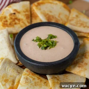 Taco Bell Quesadilla Sauce: Copycat Recipe & Serving Tips 9 Taco Bell quesadilla sauce in a bowl surrounded by quesadillas
