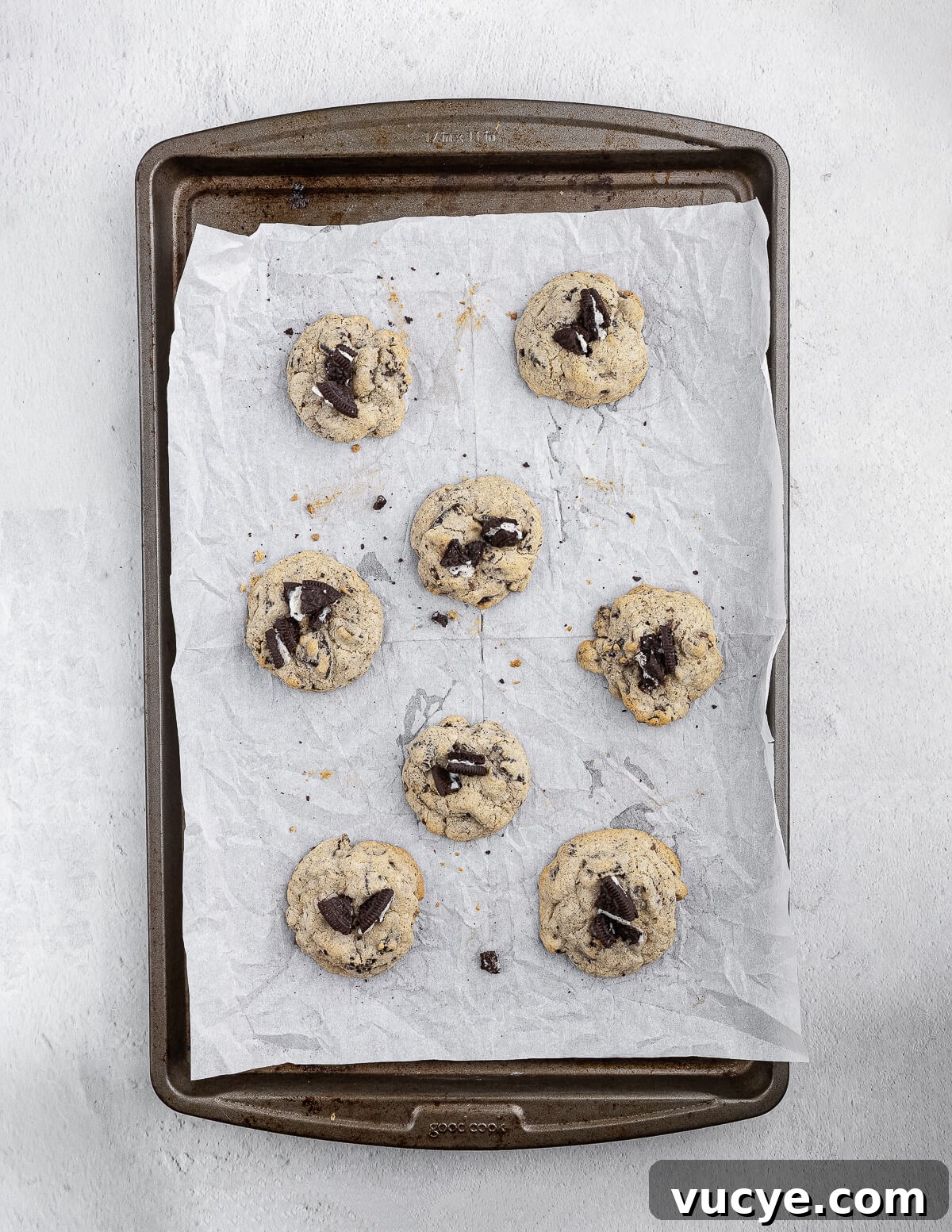 Oreo Chocolate Chip Cookies Recipe — Crispy Edges, Chewy Center 16 cookies and cream cookies on a sheet pan.