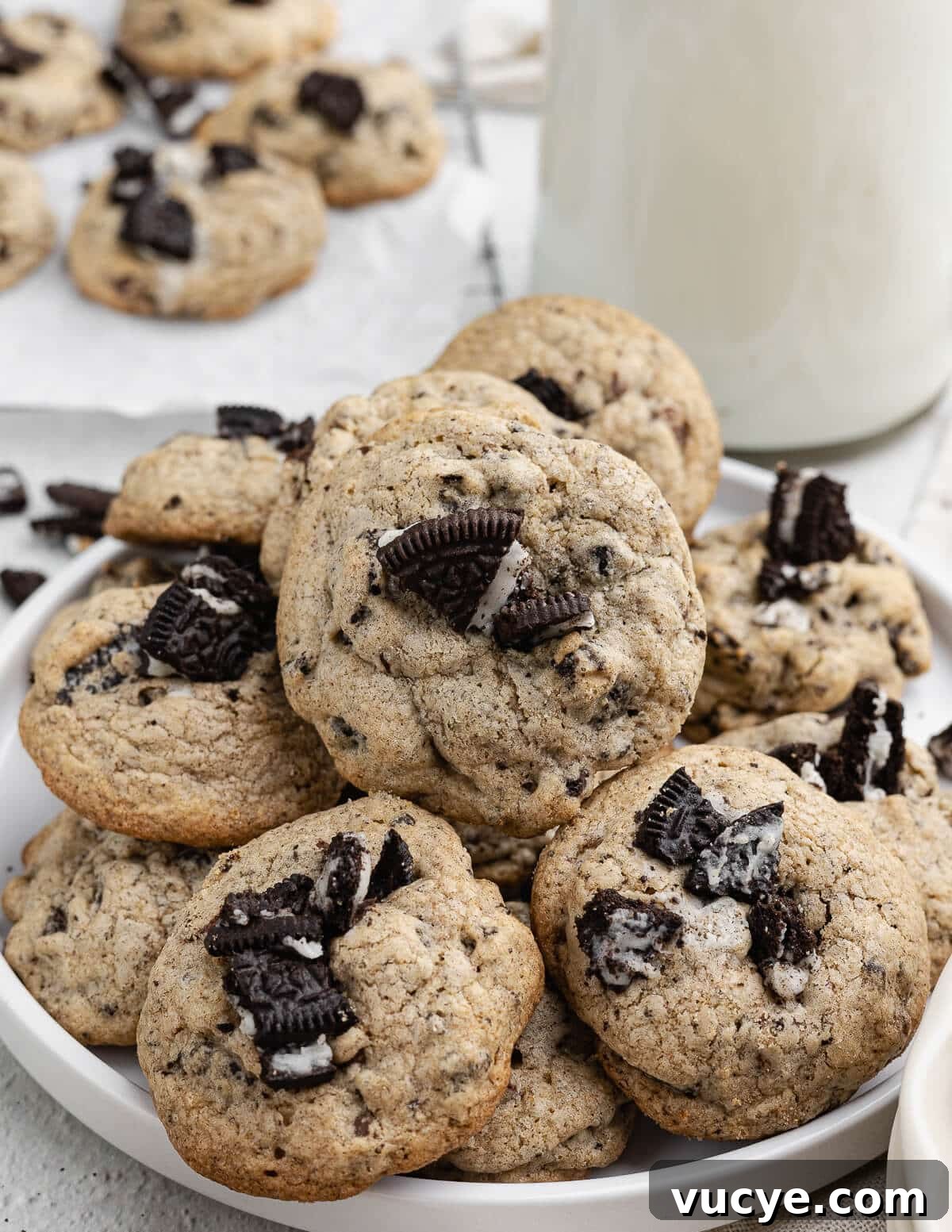 Oreo Chocolate Chip Cookies Recipe — Crispy Edges, Chewy Center 17 chocolate chip Oreo cookies stacked on a plate.