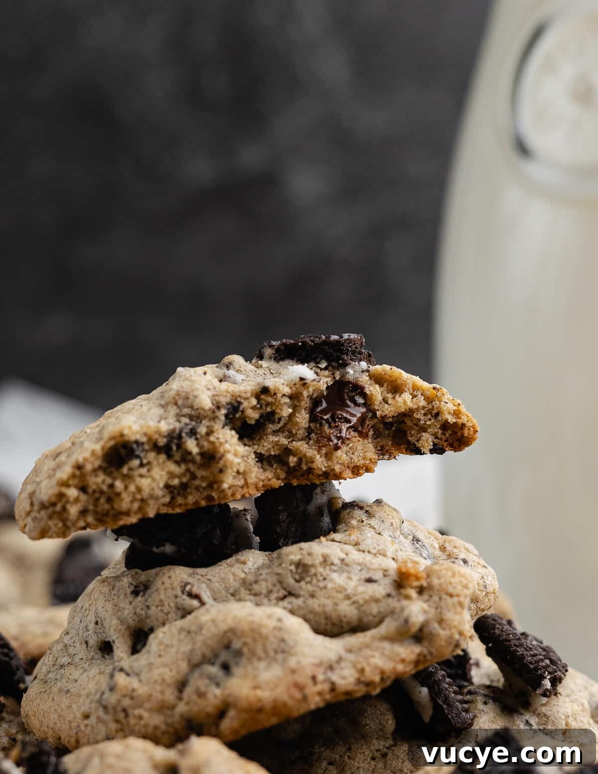 Oreo Chocolate Chip Cookies Recipe — Crispy Edges, Chewy Center 4 a stack of cookies and cream cookies with a bite out of it.
