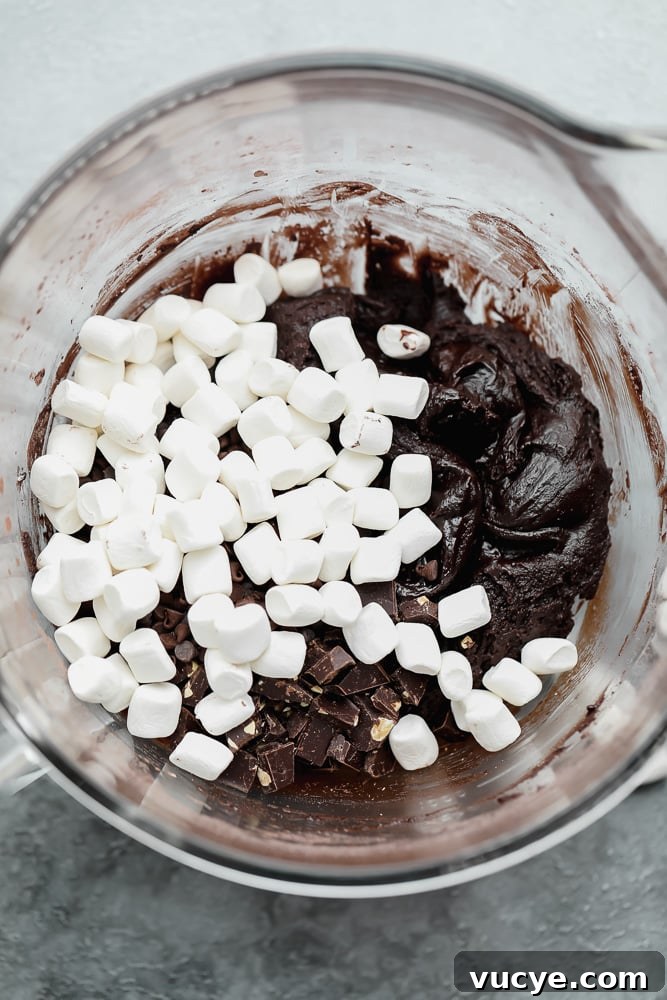 Chewy Chocolate Marshmallow Cookies with Gooey Centers 4 chocolate batter and marshmallows in a large white bowl