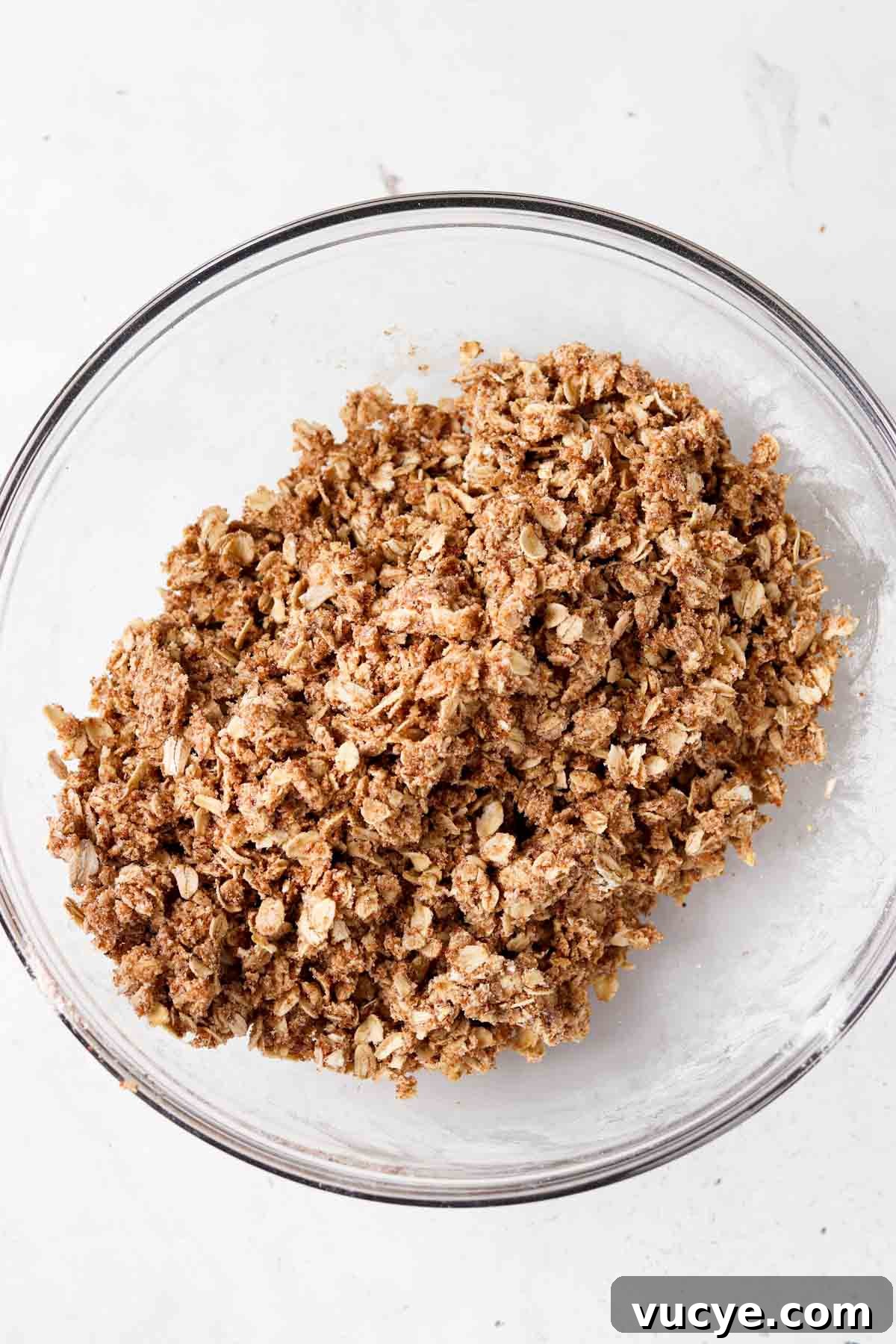 Apple and Blueberry Crumble Recipe: Light, Fruity Dessert Guide 6 Oat crumble topping in a glass bowl with ghee mixed in.