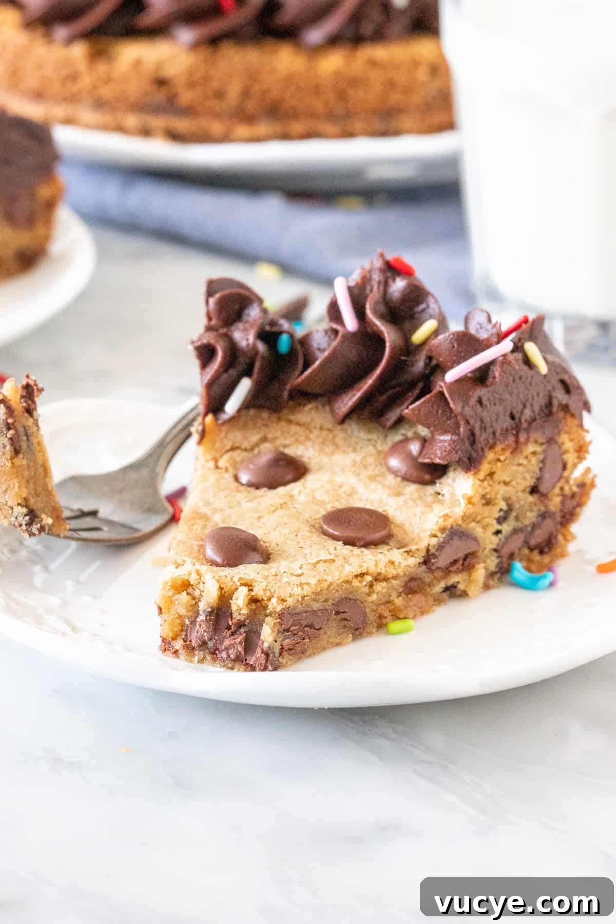 Chocolate Chip Cookie Cake Recipe: Soft, Chewy & Crowd-Pleasing 6 Slice of chocolate chip cookie cake with a bite taken out.