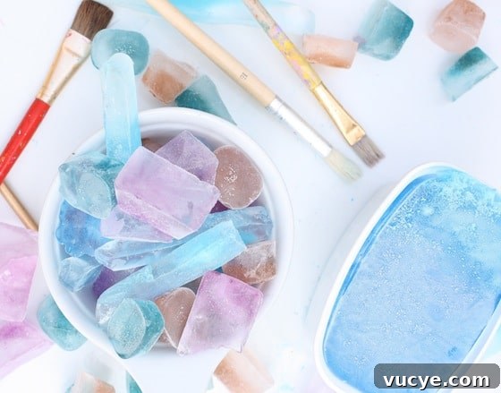 Frozen Fractals: Creative Ice Sculpture Activities for Kids 4 Coloured ice cubes, paint brushes for science activity with kids