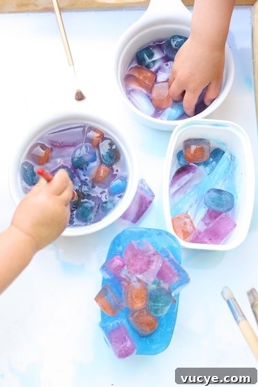 Frozen Fractals: Creative Ice Sculpture Activities for Kids 6 bowls of coloured ice cubes for a science activity for kids