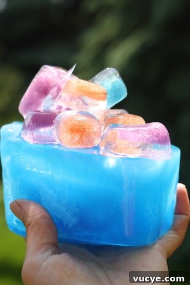 Frozen Fractals: Creative Ice Sculpture Activities for Kids 7 Structure built with coloured, glittery ice cubes