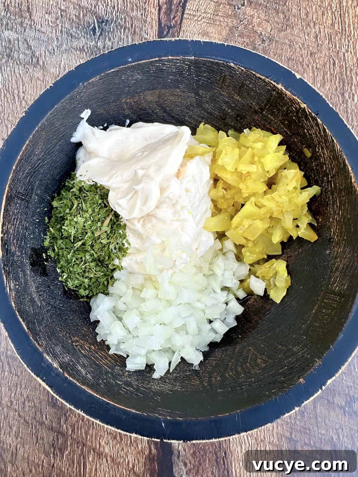 Homemade Tartar Sauce Recipe for Fish and Seafood 6 Tartar sauce ingredients in a bowl.