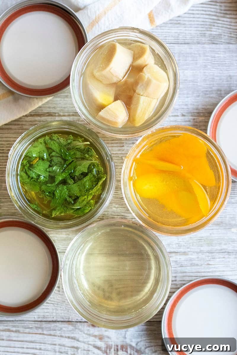 looking into mason jars of simple syrup while herbs, fruit, and spice infuse