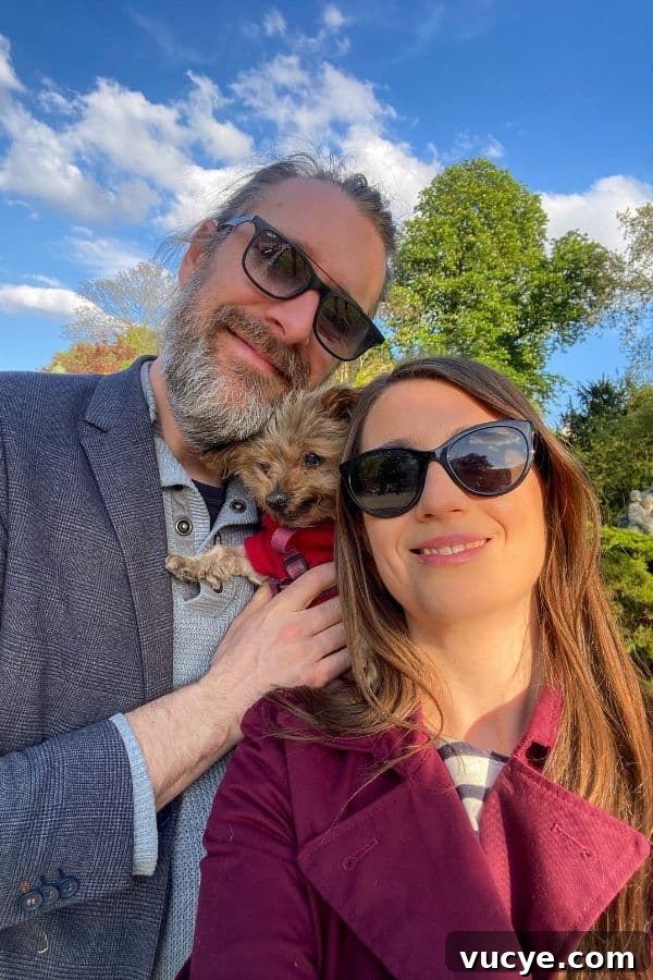 Ternes-Wagram-Pereire Neighborhood Guide: What to See, Eat & Do 2 man, woman and yorkie in the Ternes Wagram Pereire neighborhood in Paris France