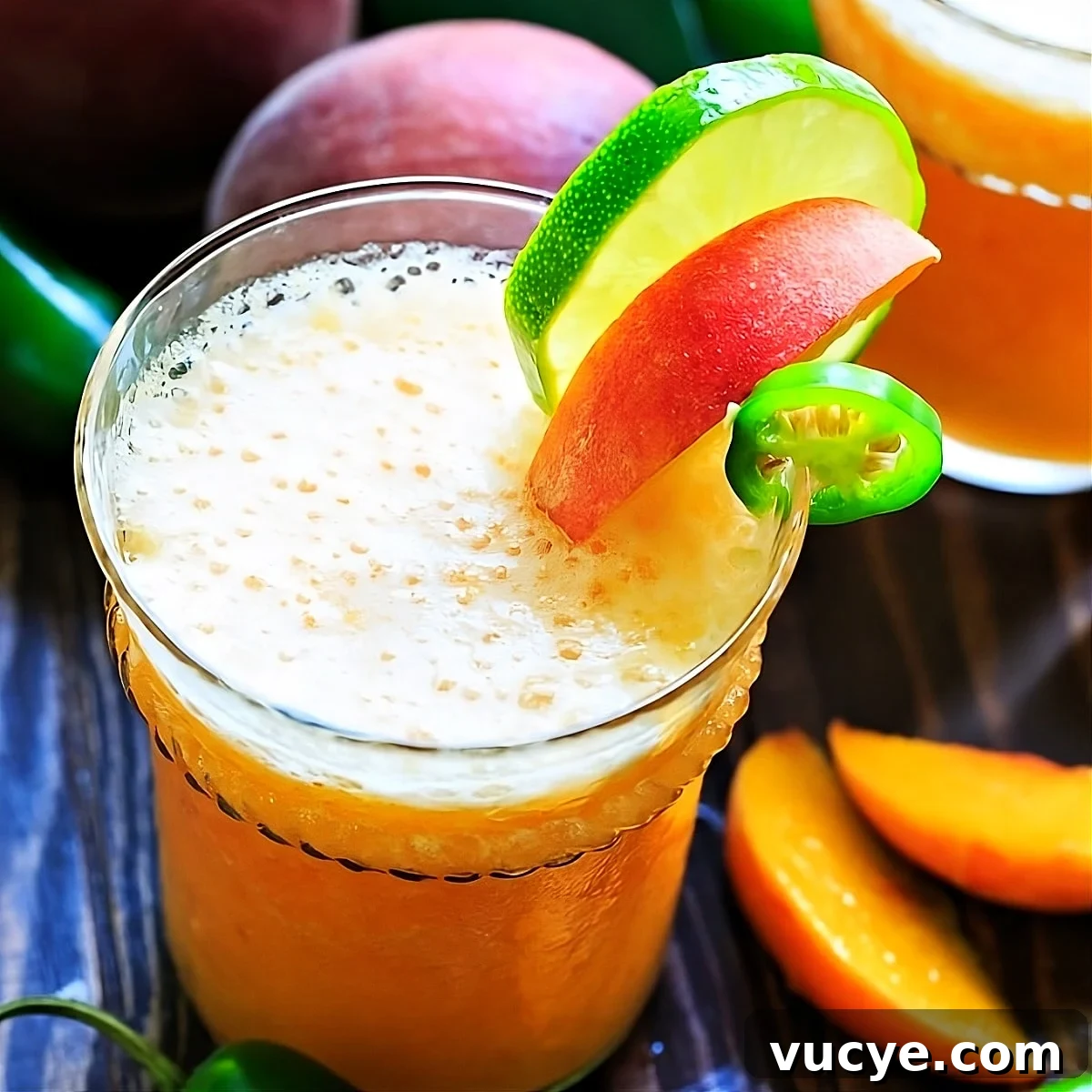 Peach Jalapeño Margarita Recipe: Refreshing Spicy Summer Cocktail 2 Peach Jalapeno Margarita in a cocktail glass.